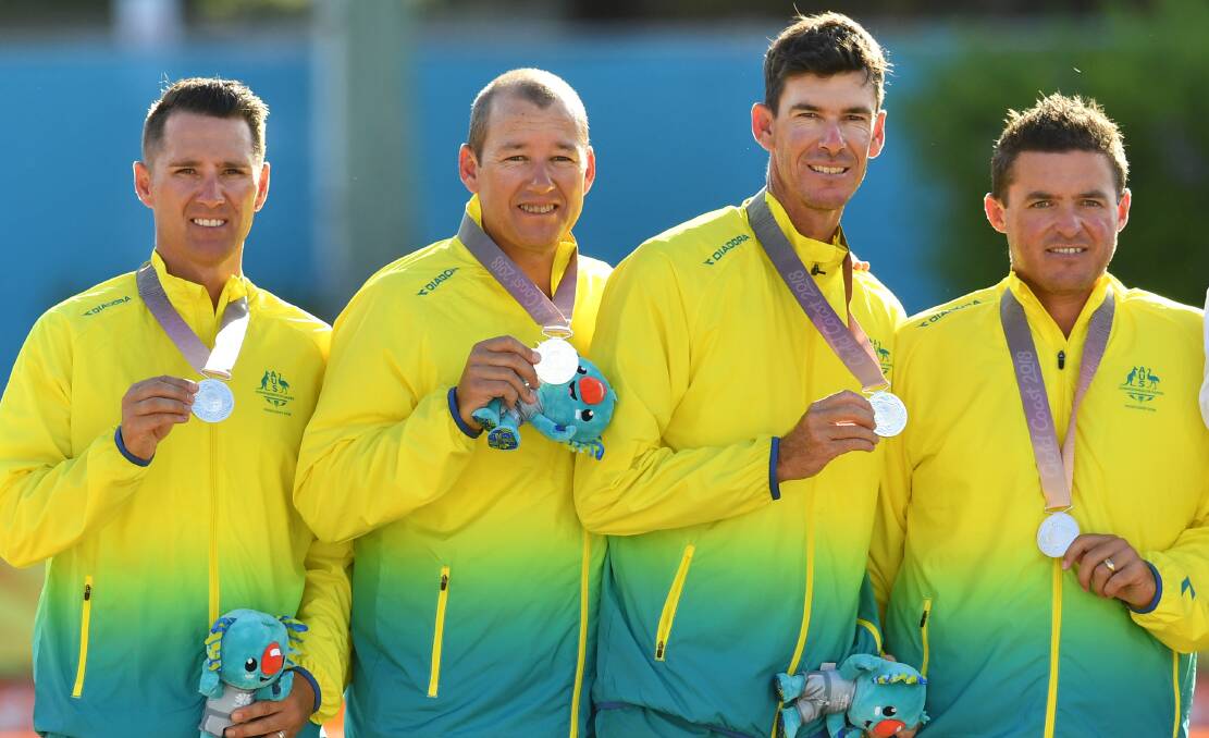 PROUD: Barrie Lester, Brett Wilkie, Nathan Rice and Aron Sherriff with their silver medals. Picture: AAP Images