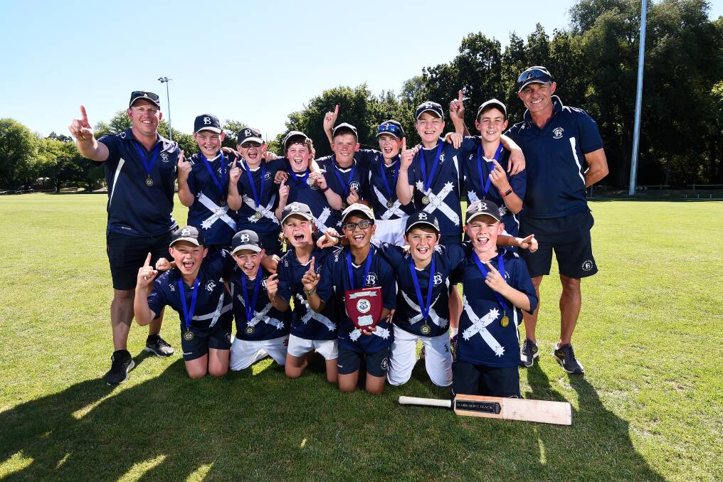 UNDER-13: The victorious Ballarat Blue in celebration mode after defeating Gisborne Green in the final.