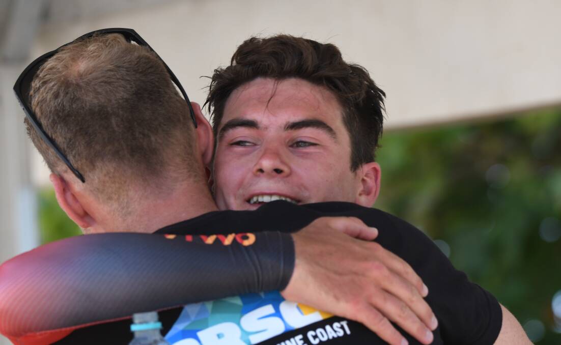 BREAKTHROUGH: An emotional Liam Magennis is embraced after his gold medal performance in the under-23 men's time trial. Picture: Lachlan Bence