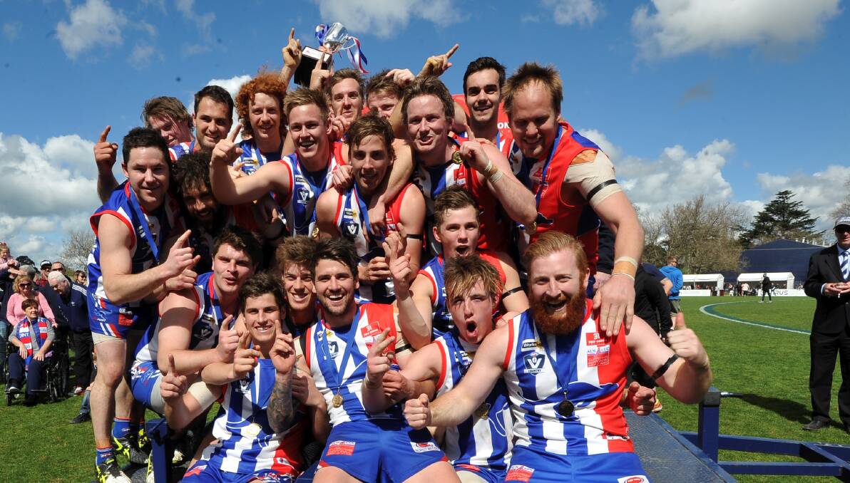 OUR TIME: East Point player get theirs hand on the reserves premiership cup and aren't they happy. Picture: Lachlan Bence