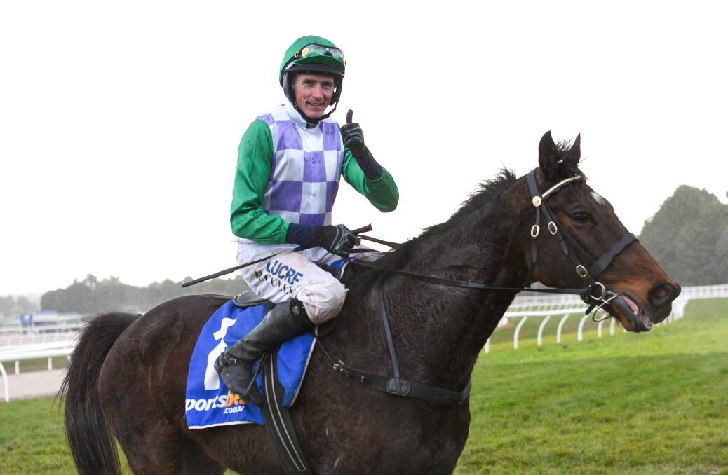 FINALIST: Ballarat jumps jockey Richard Cully gives the thumbs up after a win on champion steeplechaser Wells. Picture: AAP Images