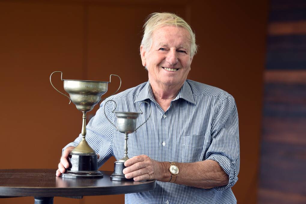 FOUND: Arthur Powers with two of his lost trophies, including the 1961 Wendouree club best and fairest (left). Picture: Kate Healy