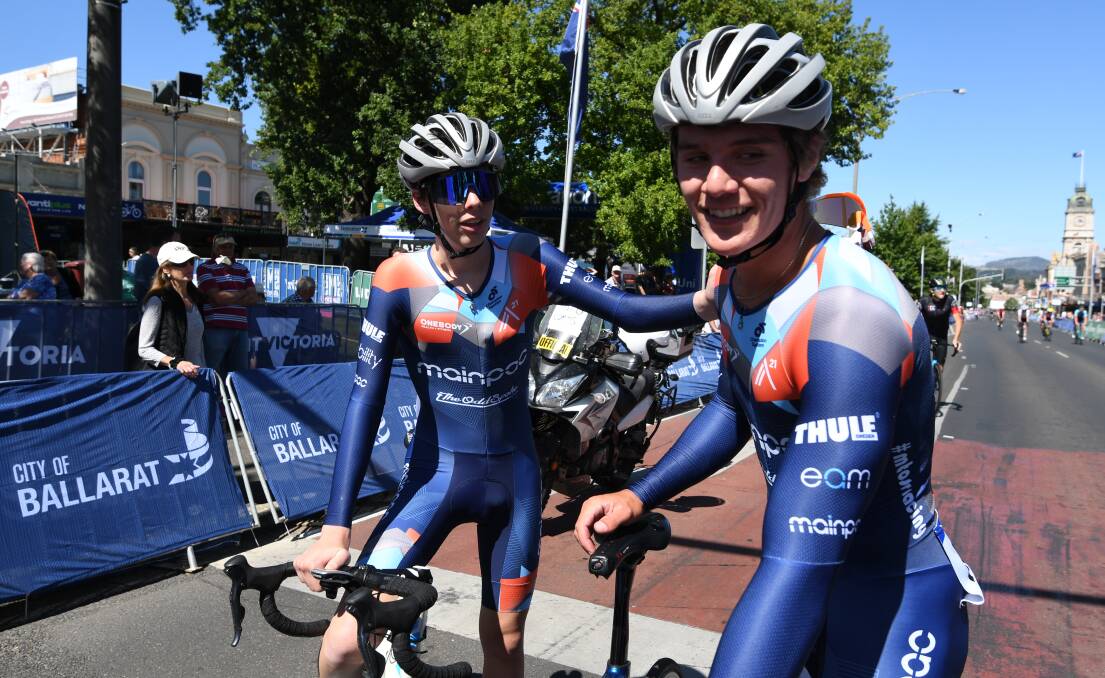 WELL DONE: Stephen Cuff is congratulated by a teammate after talking out the under-19 men's criterium. Picture: Lachlan Bence