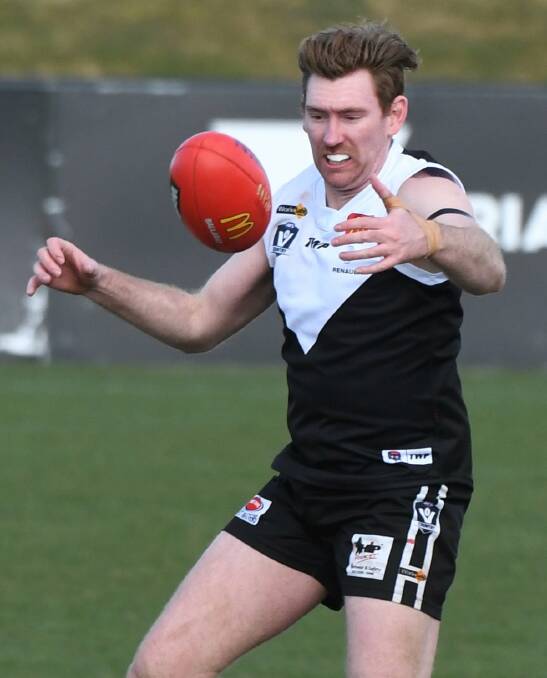 BIG MAN: Nathan Dunstan, pictured playing for North Ballarat City last season, has been lured to Hepburn in the Central Highlands Football League.