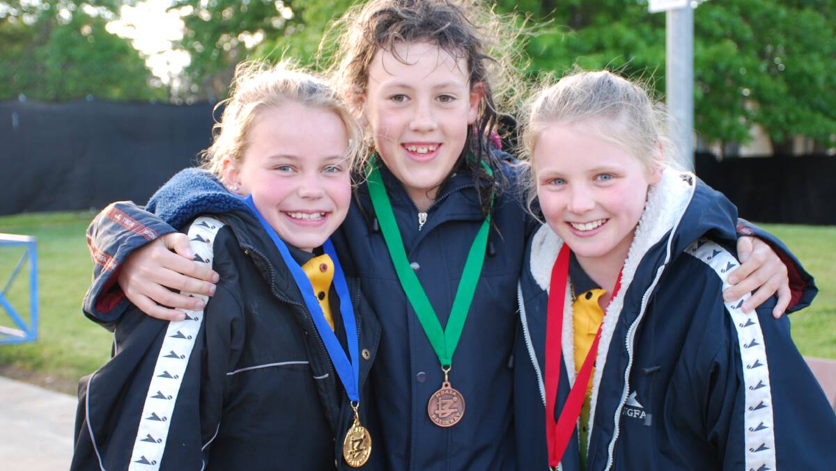GCO TEAMMATES: Midlands girls' 11/under 800m medallists Taylor Mason, Jazmin Vincent-Durow and  Lucy Richardson.