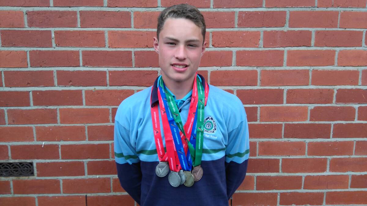 BIG DAY: Ballarat High School student Jake Ashmore with his five medals - one gold, three silver and one bronze.