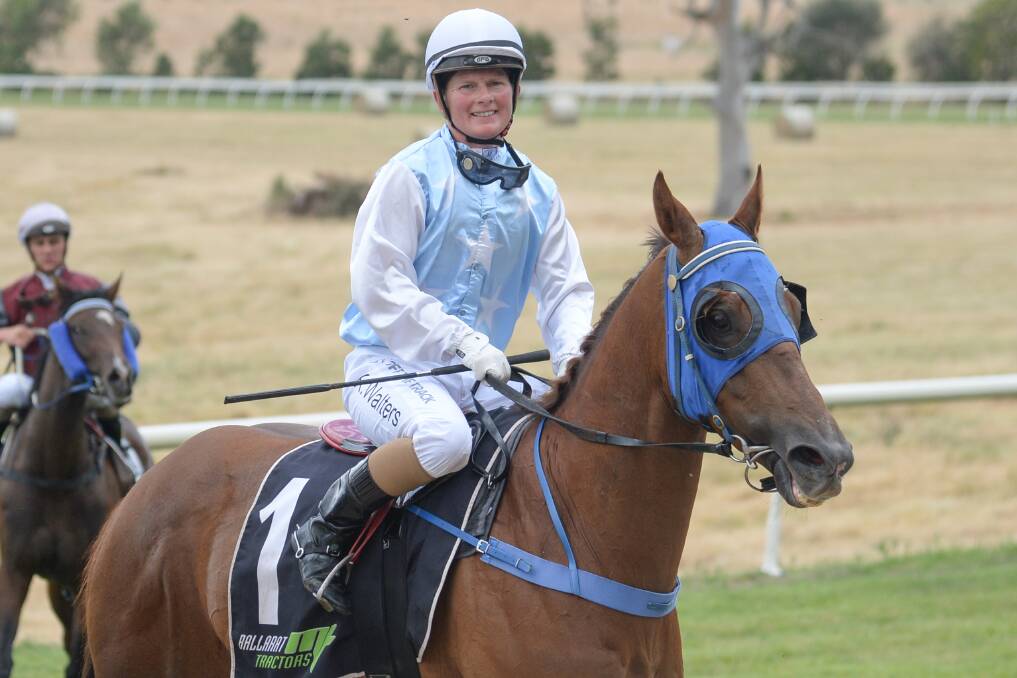 ON TOP: Kate Walters returns to the mounting yard on Craiglea Blizzard after winning the Mt Misery Sand and Soil Maiden. Picture: Ross Holburt/Racing Photos
