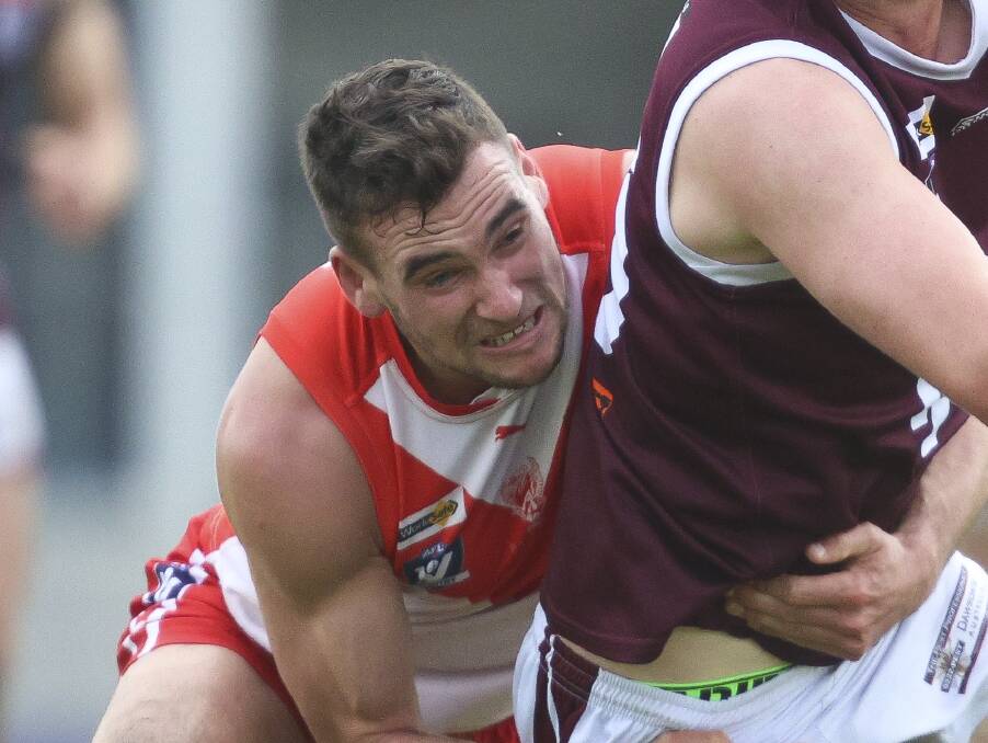 Aiden Domic lays a strong tackle for Ballarat Swans. Picture by Luke Hemer.