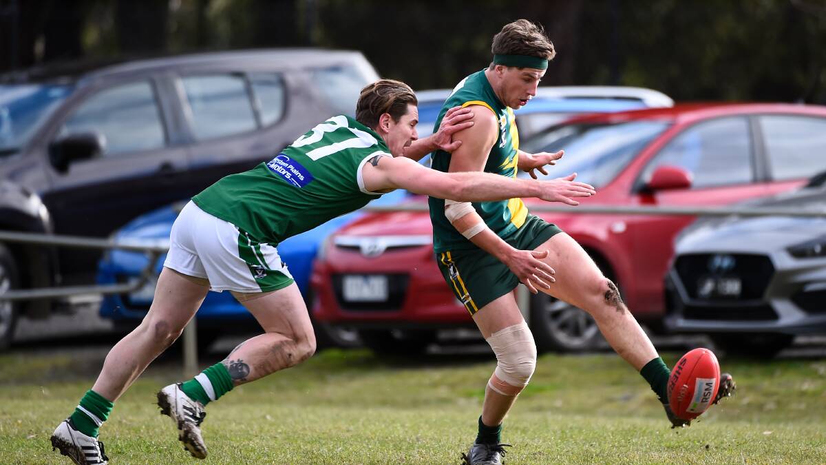 Adam Toohey gets a kick away for Gordon despite the efforts of Rokewood-Corindhap's Callan Anderson at Gordon. Picture: Adam Trafford