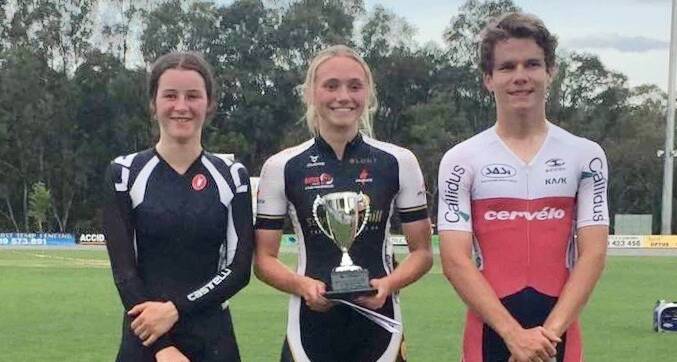 ON TOP: Alaya Humber is all smiles on the dais with the Wangaratta Wheelrace trophy.