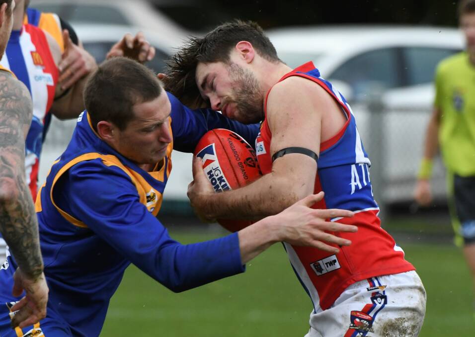 Lachie Cassidy (Sebastopol) and Billy Jones (East Point) lock horns in a tackle which left Jones concussed and Cassidy on report. Picture: Lachlan Bence.