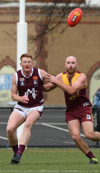 Redan key defender Pat Britt tries to keep Melton big forward Mark Orr off the ball at the City Oval. Picture: Lachlan Bence
