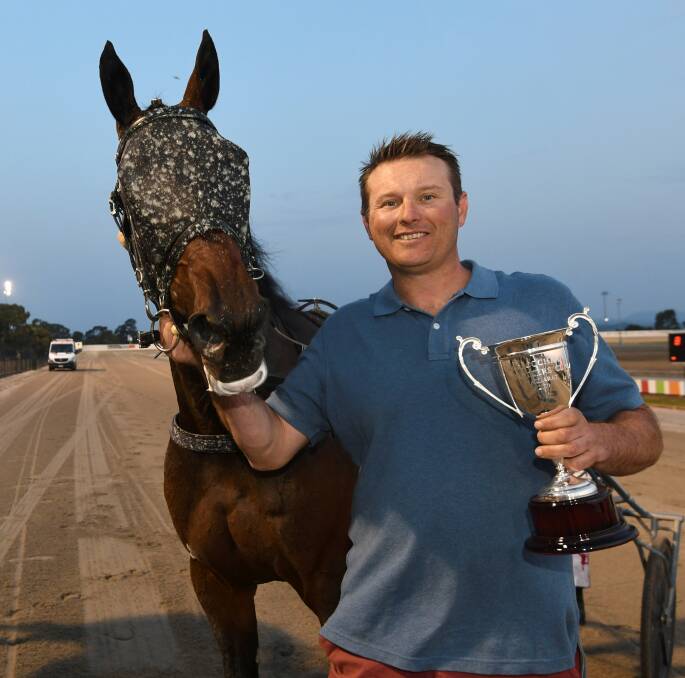 Trainer Anton Golino with Dance Craze and the EB Cochran Cup trophy. Picture: Lachlan Bence