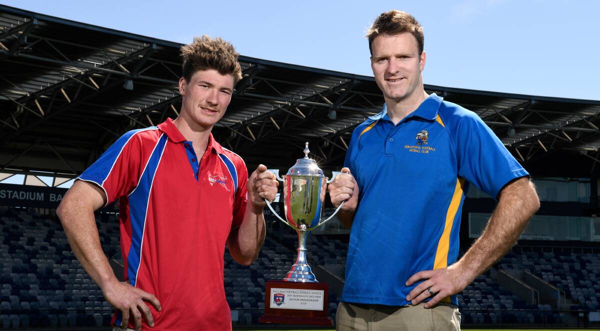 HANDS ON THE PRIZE: East Point co-captain Matt Johnston and Sebastopol
captain Tom Petersen with the 2019 BFL premiership cup at Mars Stadium.