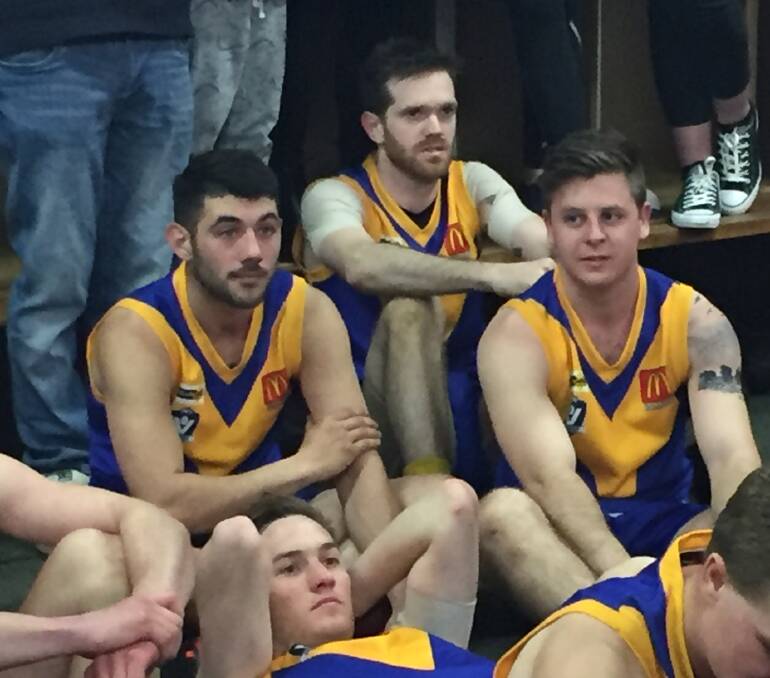 Michael Powell, centre, looking nice anbd relaxed after a seven-goal haul for Sebastopol.