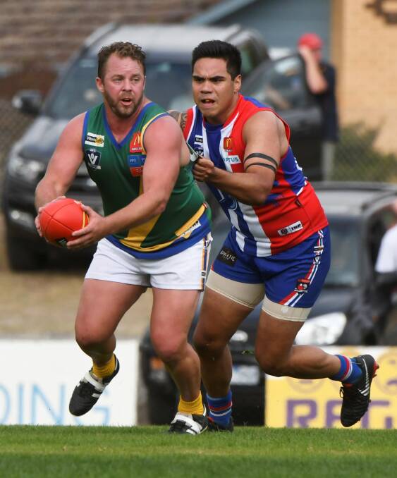 RUN DOWN: Mickitja Rotumah-Onus chases down Lake Wendouree recruit Shane Hutchinson at the Eastern Oval. Picture: Lachlan Bence