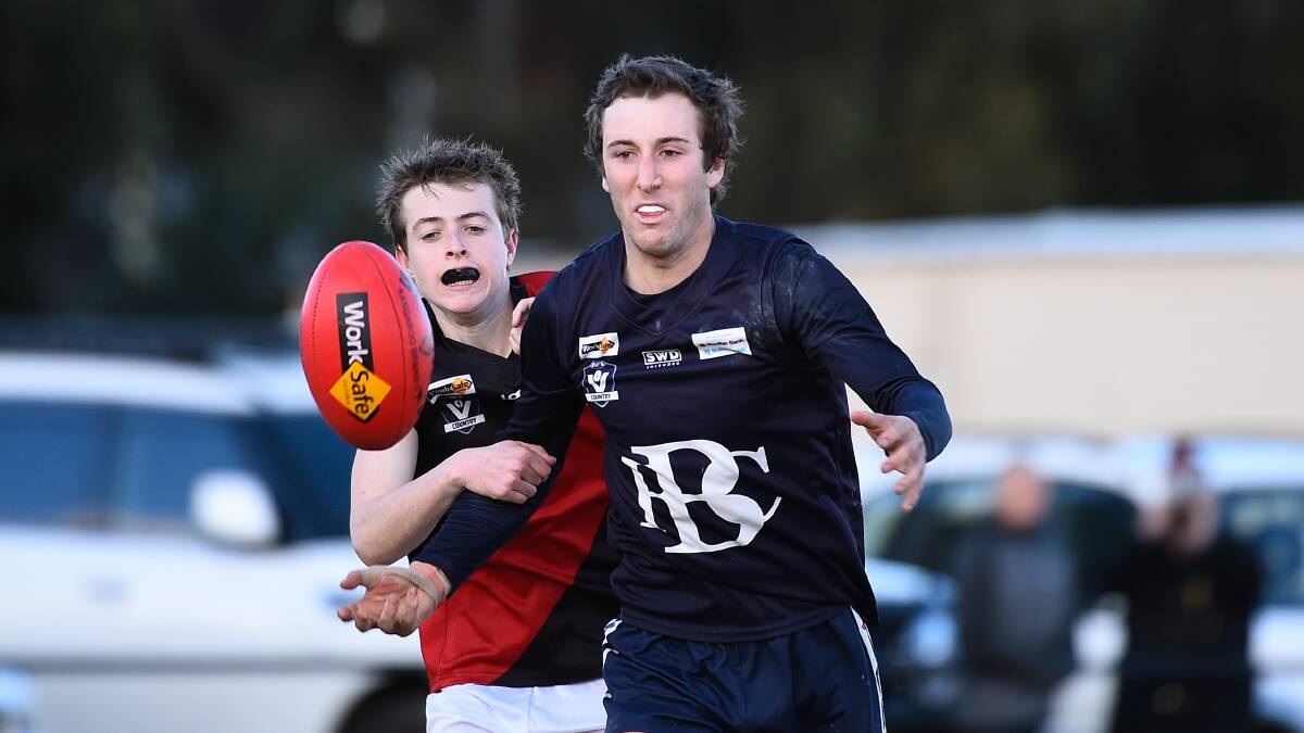Evan Shaw (Ballan) and Abraham Grant (Buninyong) go hard at it at Smythesdale.Picture: Adam Trafford