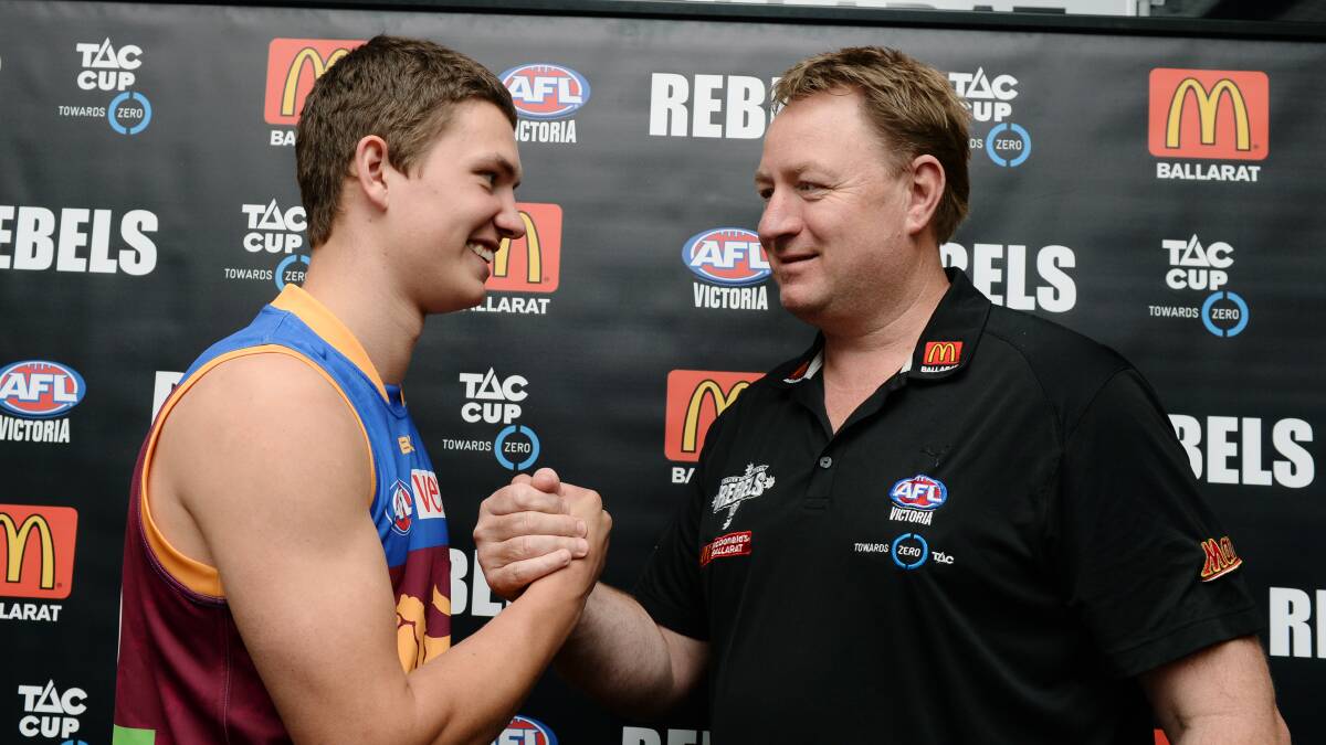 WELL DONE: Rebels regional talent manager Phil Partington congratulates Tom Berry. Picture: Kate Healy