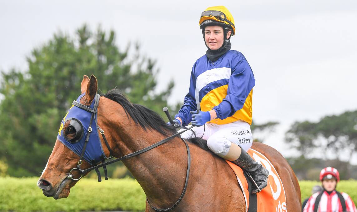 Michelle Payne returns to the mounting yard aboard Argus - the second leg of her riding double and training treble at Mornington on Monday. Picture: Racing Photos