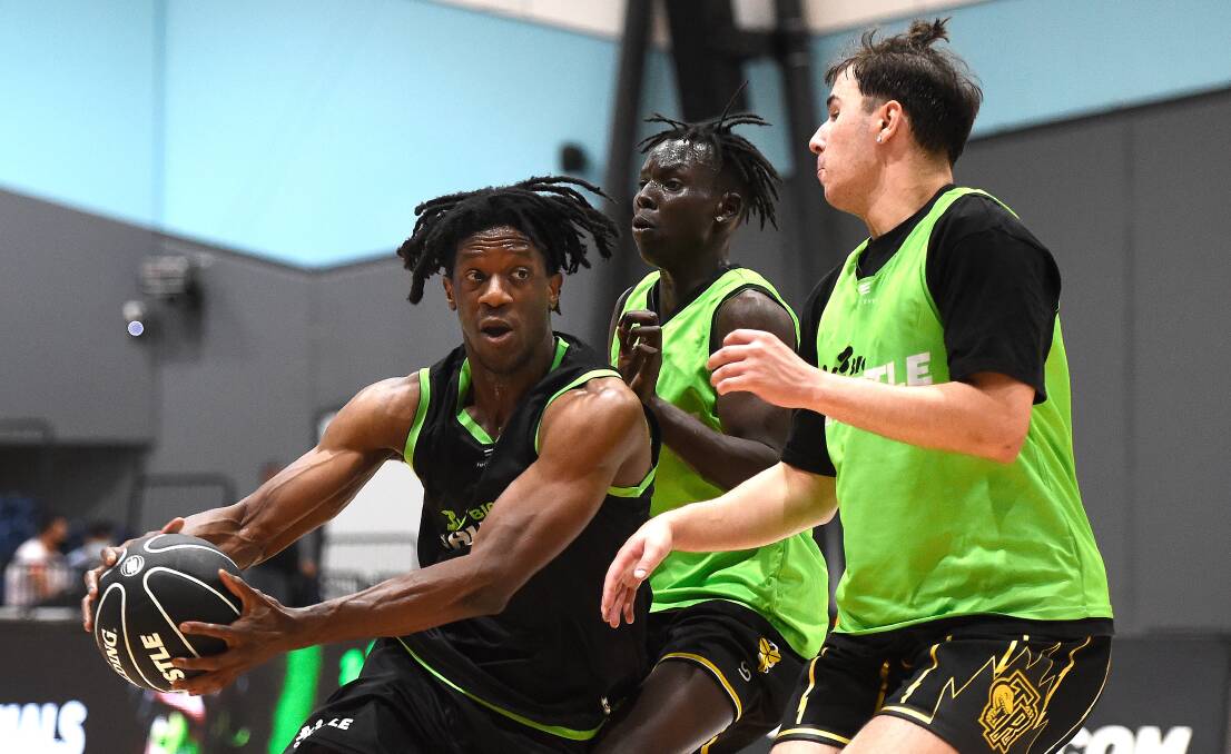 TIGHT: Owen Odigie, of Hoops Capital, runs into Yai Ayany and Basil Ivanina (4KayTre) in the open men's competition. Picture: Adam Trafford 