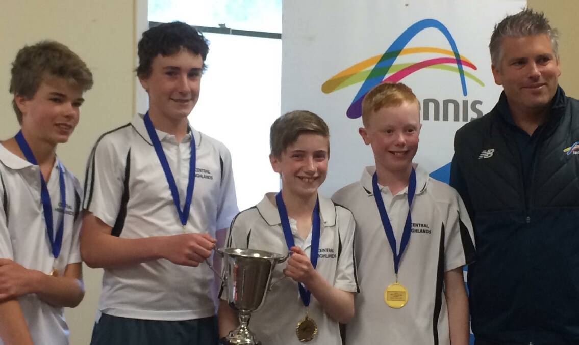 TRIUMPHANT: Central Highlands players Harry Wills, Joe Freeman, James O’Sullivan and Miles Sheridan with the Fitzgerald Cup and Tennis Victoria tournaments and events manager Andrew Reynolds.
