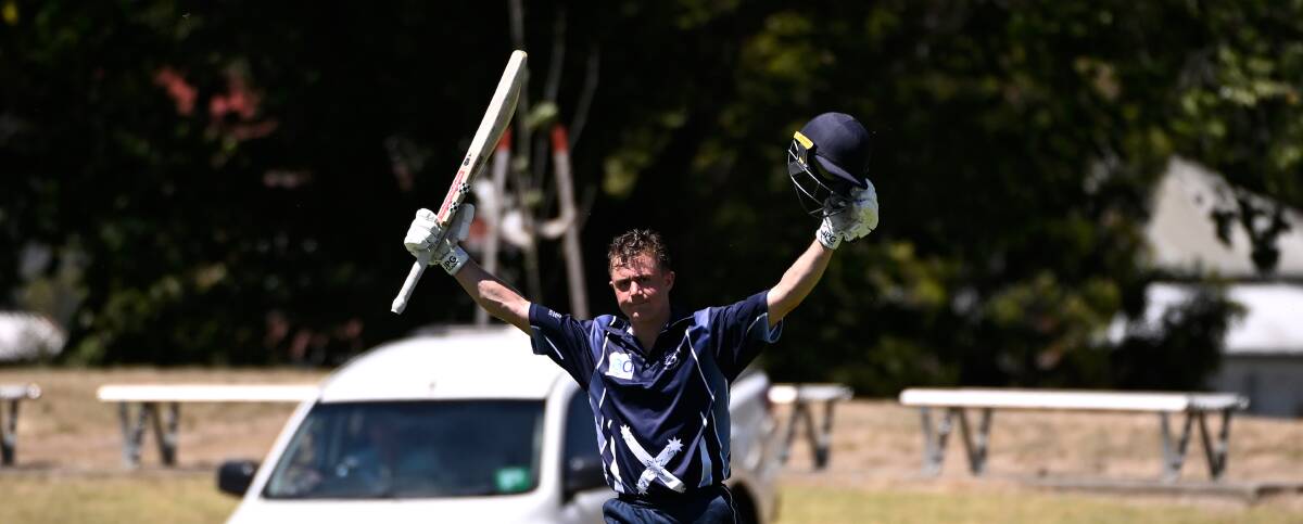 Tom Le Lievre celebrates his century for Ballarat Cricket Association on the first day of Melbourne Country Week at the Eastern Oval on Monday. Picture by Adam Trafford