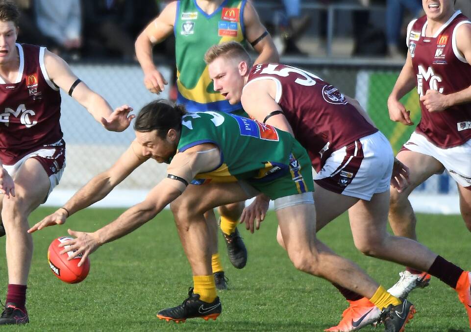 Lake Wendouree defender Sam Clifton finds front position ahead of Dyson Stevens (Melton). Picture: Lachlan Bence
