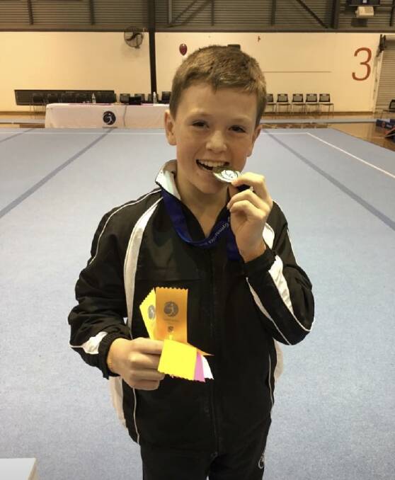 STOKED: Eureka gymnastics' Nick Howard enjoys his level 7 under-age vault gold medal in the Victorian Championships.