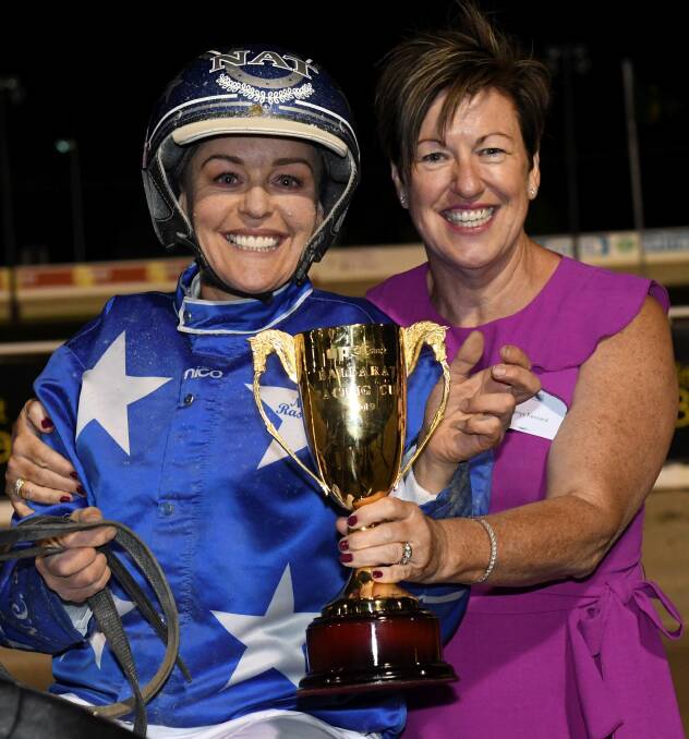 Natalie Rasmussen with owner Glenys Kennard and the Ballarat Pacing Cup. Picture: Laclan Bence