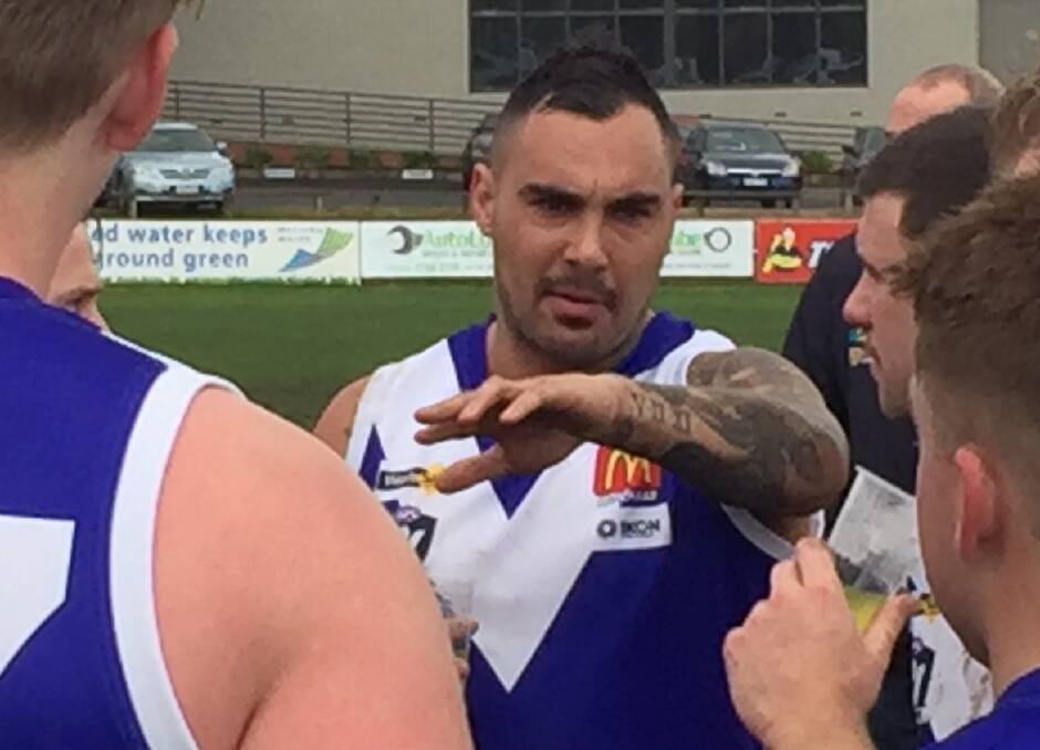 Jarrah Maksymow provides input for teammates at the quarter time break of the reserves in his Sunbury debut on Saturday. 