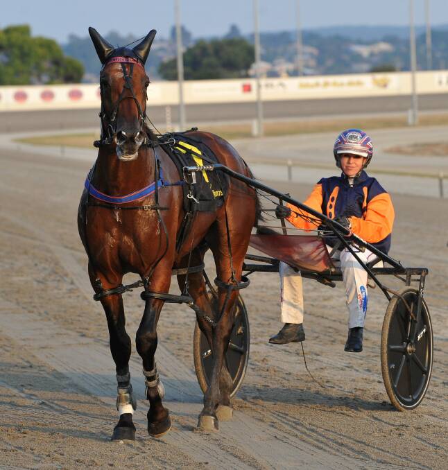 OFF TO FINAL Kate Gath with Pacifico Dream after winning a Victoria Derby heat in Ballarat on Saturday night. Picture: Lachlan Bence
