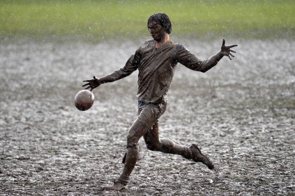 HEAD TO TOE: Learmonth's Jack Treweek completely coated in mud at trhe Leamonth ground. Picture: Kate Healy