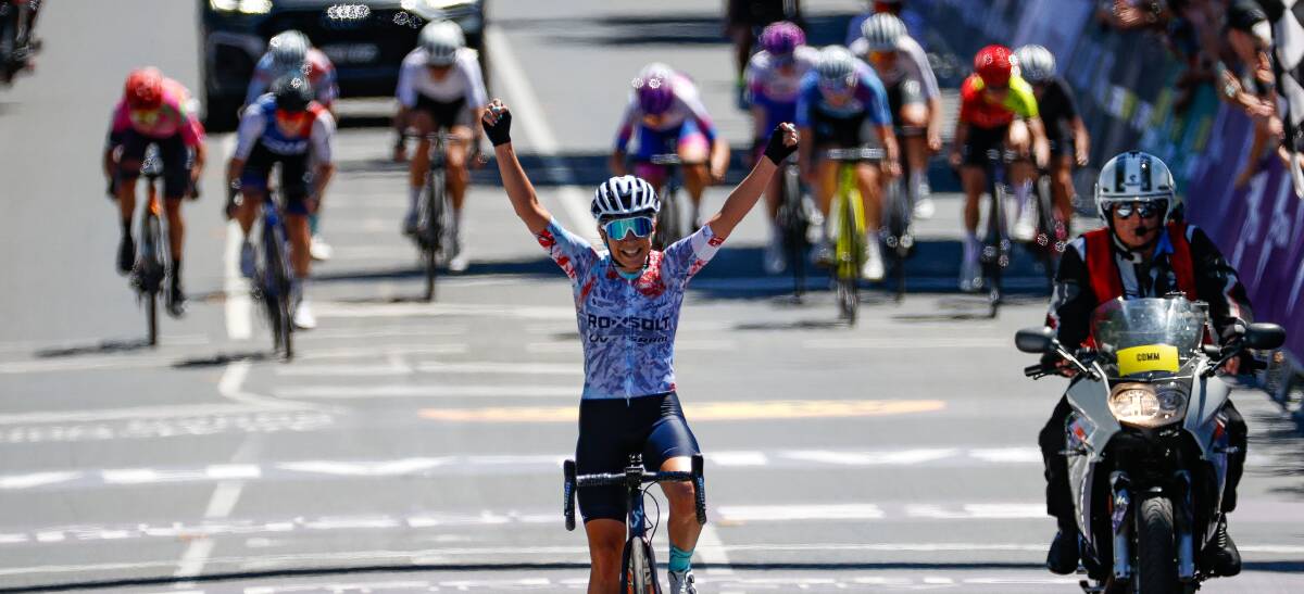 YES: With the chasers well behind, Nicole Frain gives the victory salute in national elite women's road race at Buninyong on Sunday. Picture: Luke Hemer