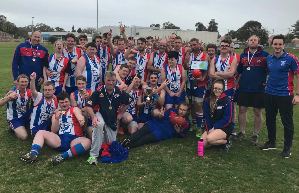 CELEBRATION: Ballarat Bulldogs celebrate after the presentation of the premiership cup at Stawell's North Park.