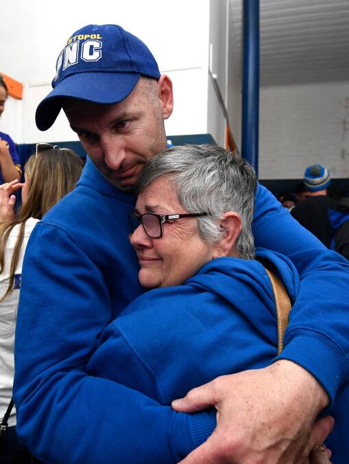 EMOTIONAL: Sebastopol coach Leigh Hutchinson and Sam Jenkins' mother Maree embrace after the Burra's preliminary final win. Pictures: Adam Trafford 