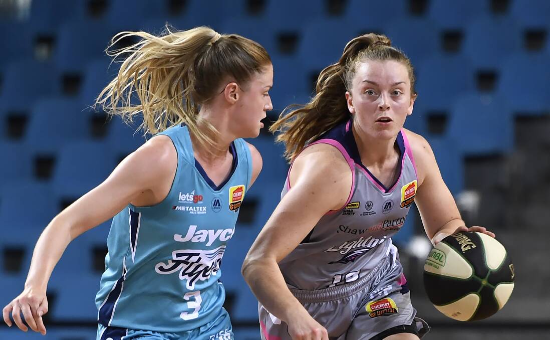 FULLY-FLEDGED: Abbey Wehrung, right, in Adelaide Lightning colours is now an Australian Opal. Picture: Getty Images.