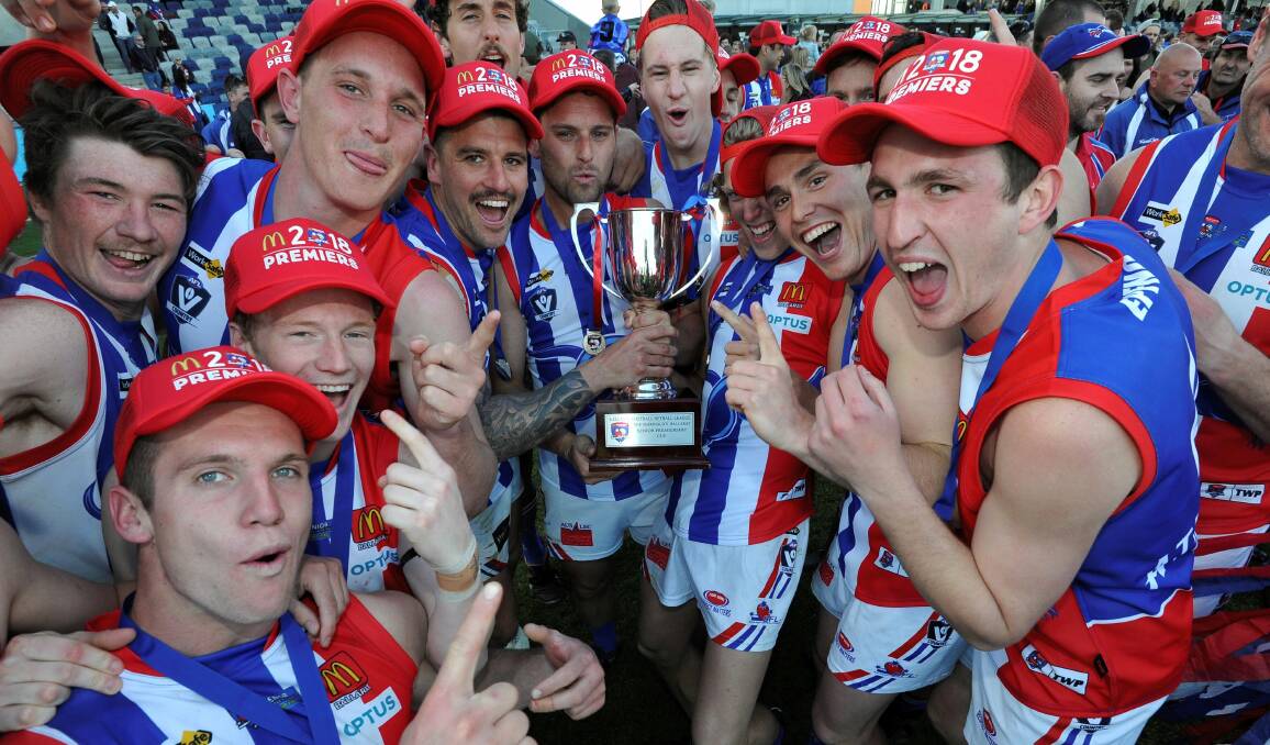 THIS IS WHAT'S ALL ABOUT: East Point players get hold of the BFL premiership cup.