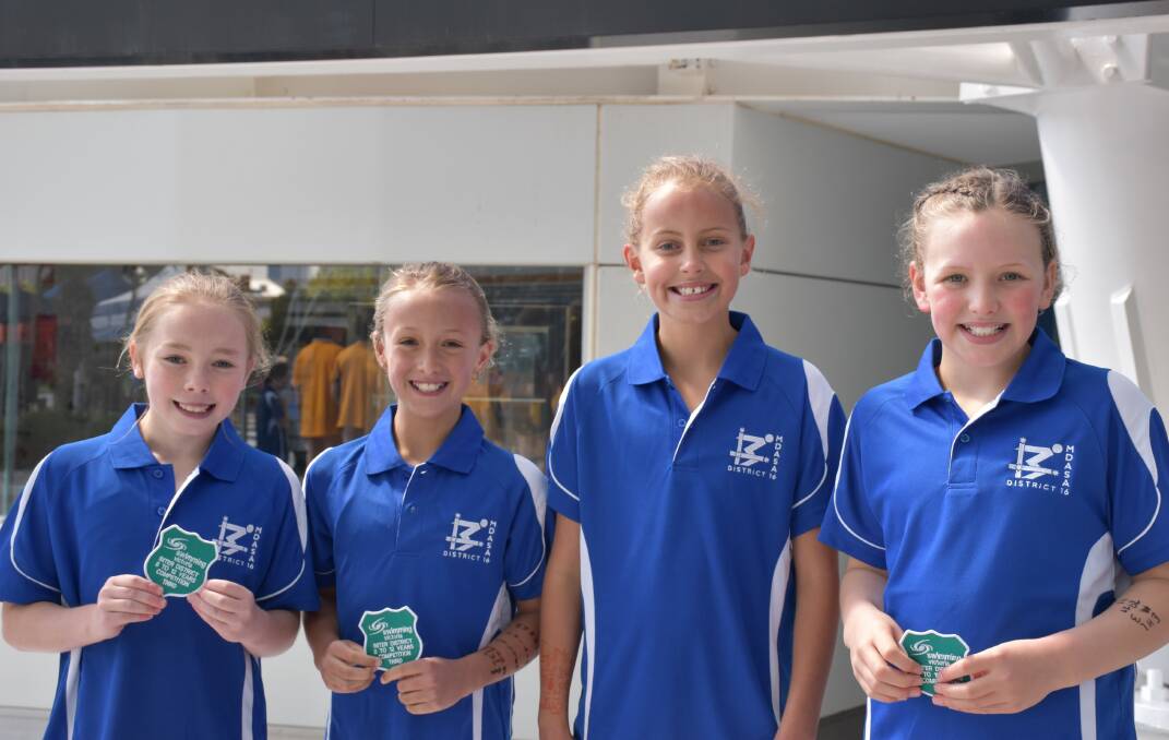 SMILES: 8-9 year girls' freestyle relay team Ava Candy, Zoe Schnyder, Eliza Ashby and Sarah Tolfrey.
