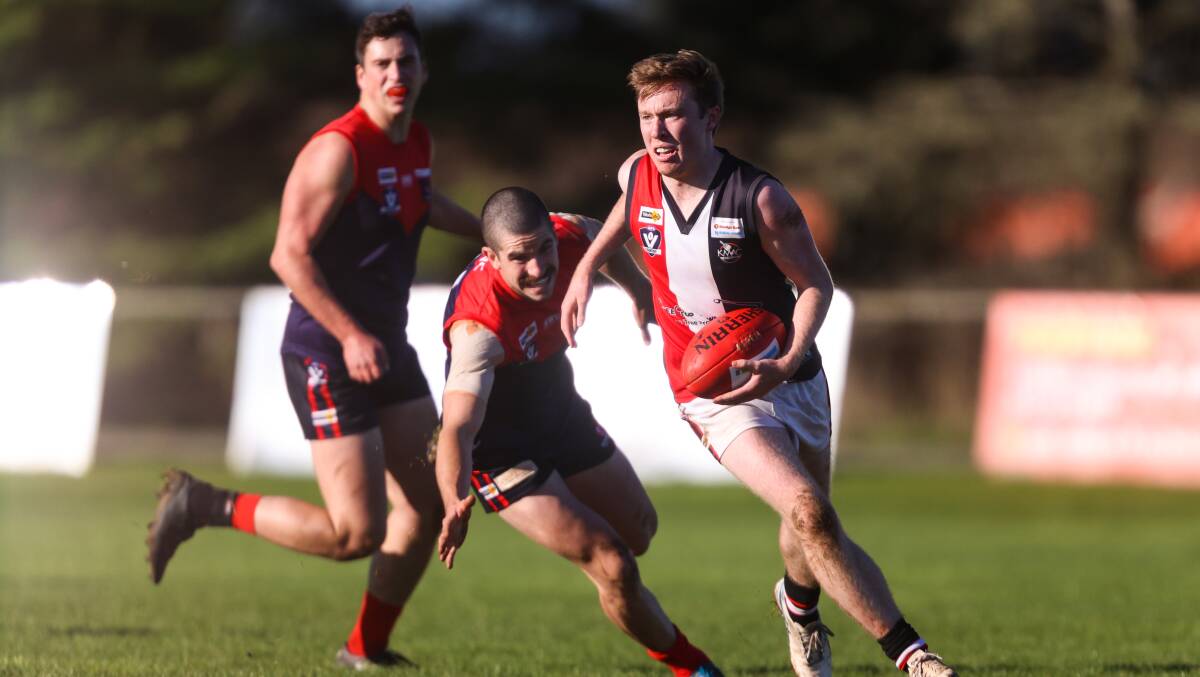 Creswick's Max Phillips gets away from Lachie Thornton from Bungaree at Bunagree on Saturday. Picture: Luke Hemer.
