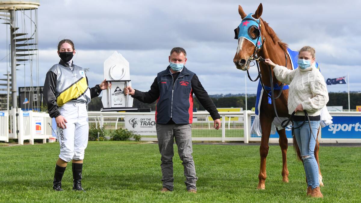 ON TOP: Alana Kelly and stand-in trainer Dean Larsson with The Hotham trophy and Brimondo. Picture: Racing Photos