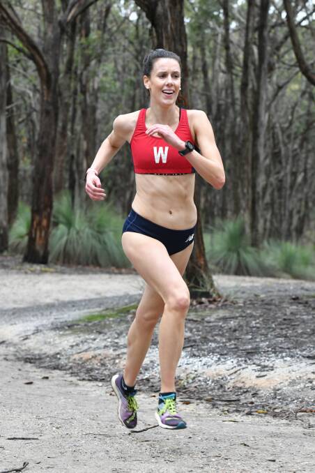 ALL SMILES: Karla Treweek approaches the finish line in the Wal Brown. Pictures: Nev Down