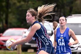 Ballan's Siobhan Keogh in full flight against Waubra in the CHNL A grade competition at Waubra on Saturday. Anna Fusea (Waubra) watches on. Picture by Adam Trafford.