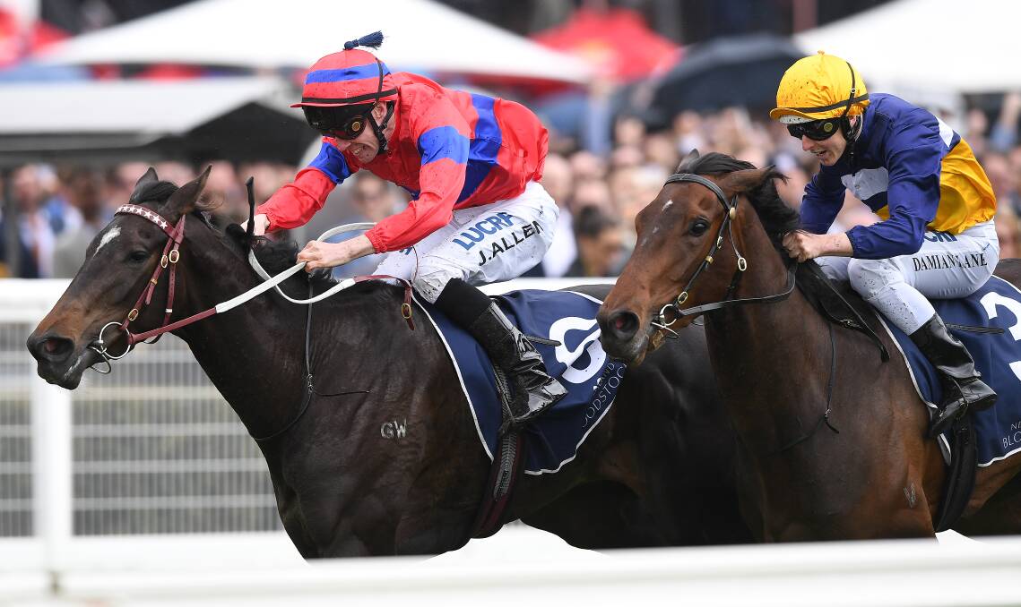 LOOKING GOOD: John Allen urges Verry Elleegant (left) to victory in the Ethereal Stakes at Caulfield on Saturday. Picture: AAP Images