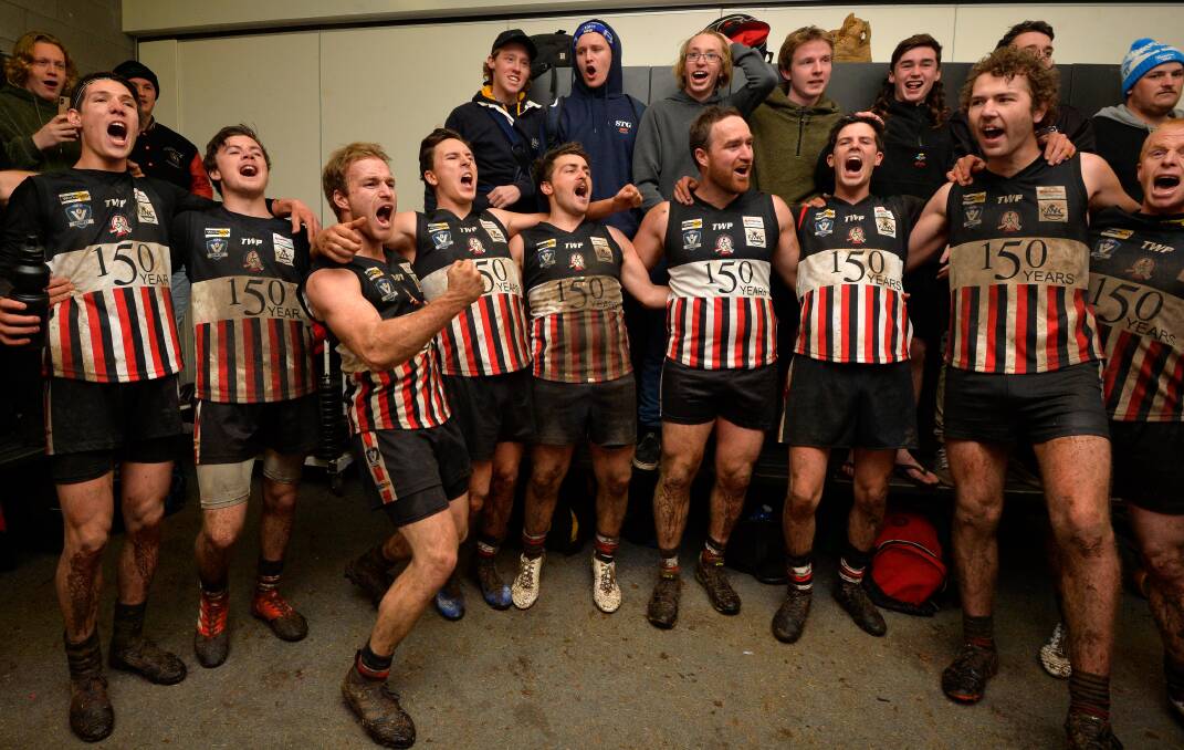 HAPPY MEMORIES: Creswick players and supporters belt out the song after a win during the 2019 Central Highlands Football League season. Picture: Adam Trafford