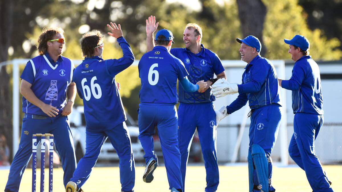 Daniel McDonald, centre, and his Golden Point teammates celebrate a wicket during the Ballarat Cricket Association Twenty20 grand final. Picture by Adam Trafford
