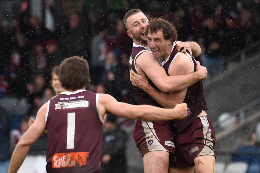 Melton's Brenton Payne and Ryan Carter celebrate after the final siren. Picture by Adam Trafford.