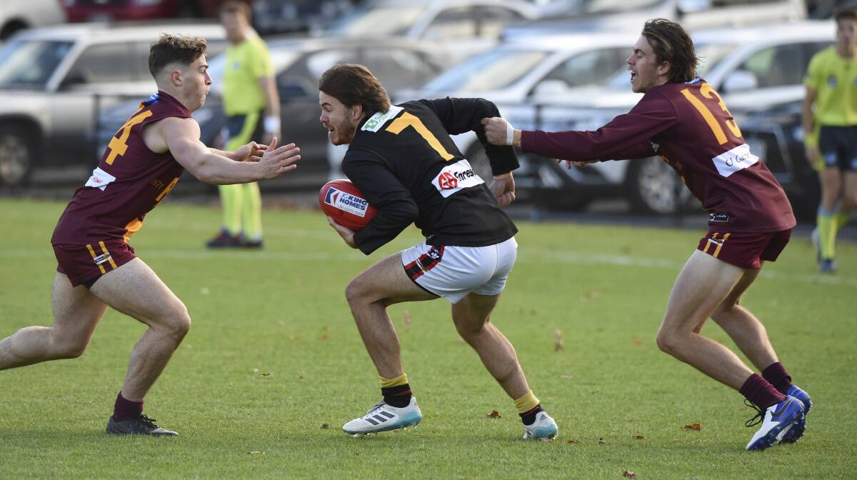 Logan Blundell splits Redan's defence. Picture: Lachlan Bence
