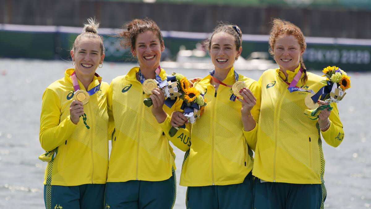 Lucy Stephan, left, on the podium with crewmates Rosemary Popa, Jessica Morrison and Annabelle McIntyre after winning gold in the women's four. Picture: Darron Cummings/AP