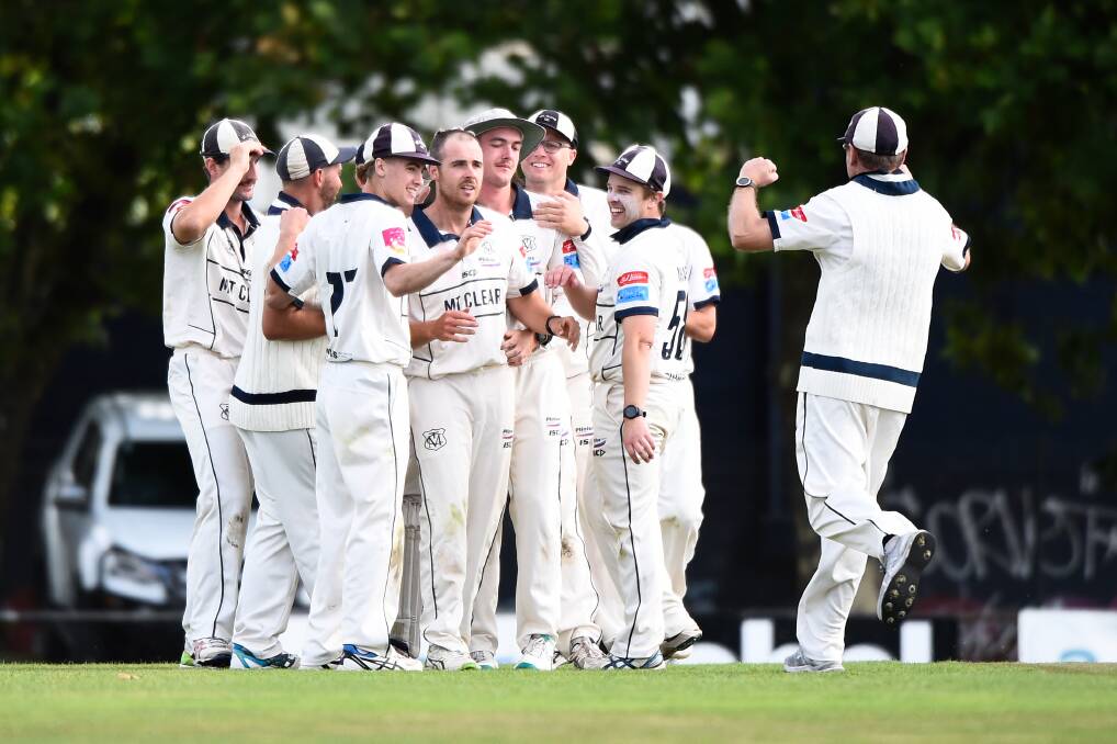 Grant Trevenen of Mt. Clear is congratulated by teammates on the winning wicket against Golden Point. Picture by Adam Trafford.