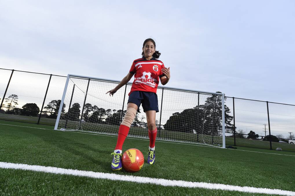 A 12-year-old Cooney-Cross during her time with the Red Devils. Picture: Kate Healy